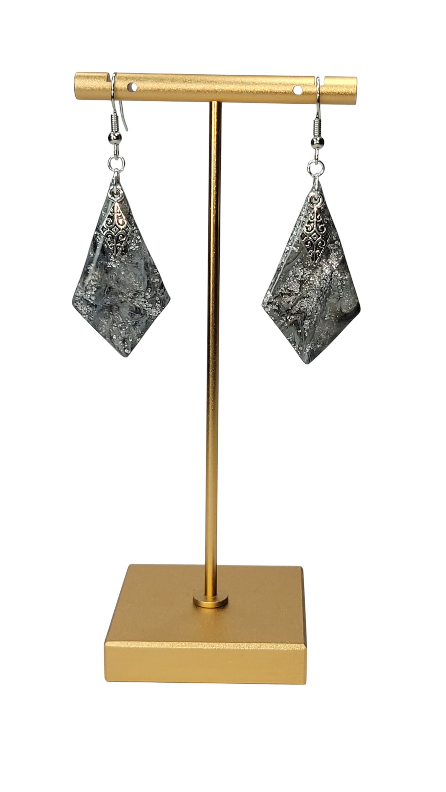 Silver on silver dangling earrings.