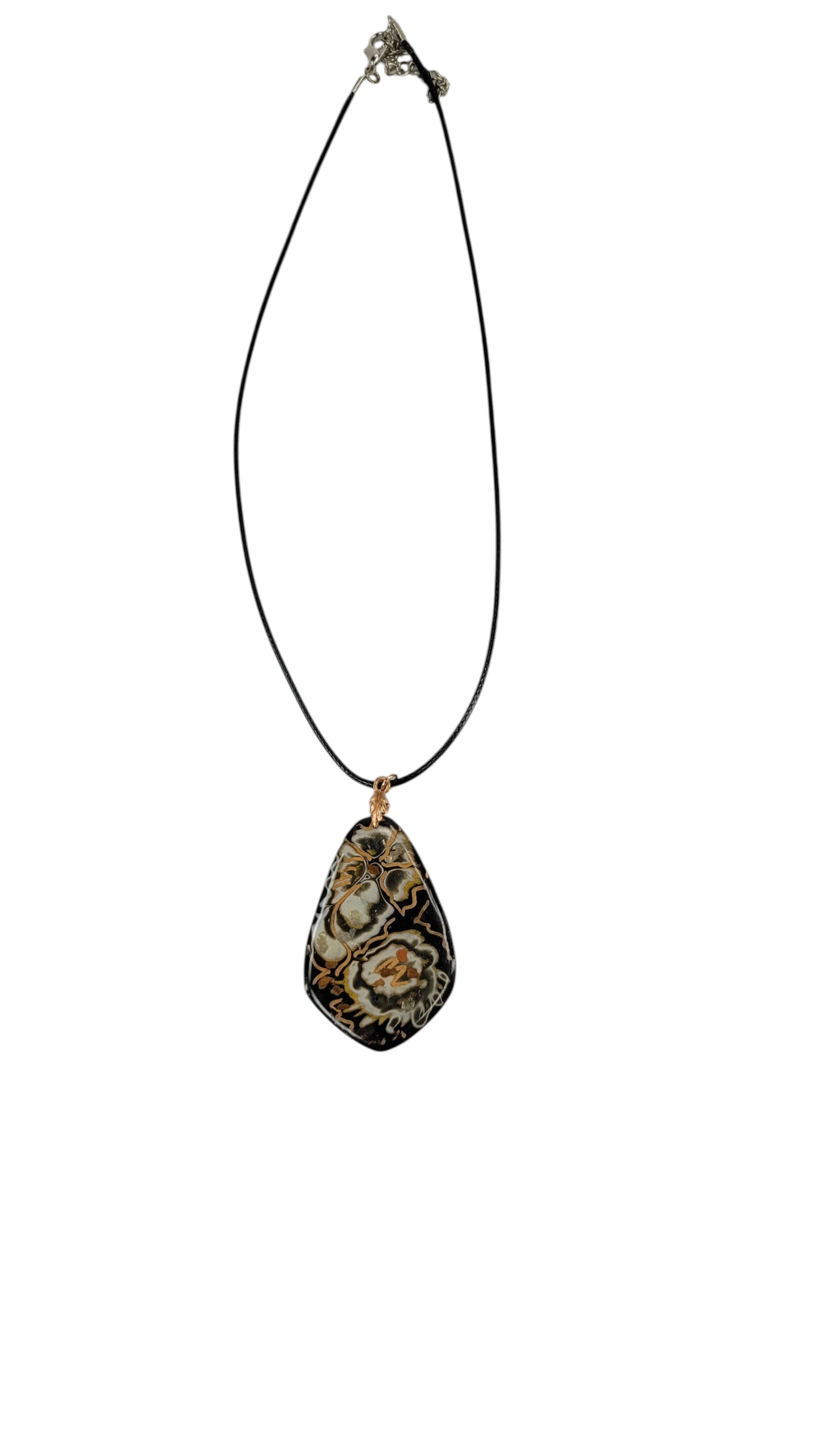 Deep blacks cradle warm golds Necklace