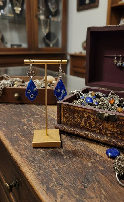 Deep blue color with a gear shaped charm Earrings