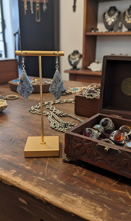 Silver on silver dangling earrings.