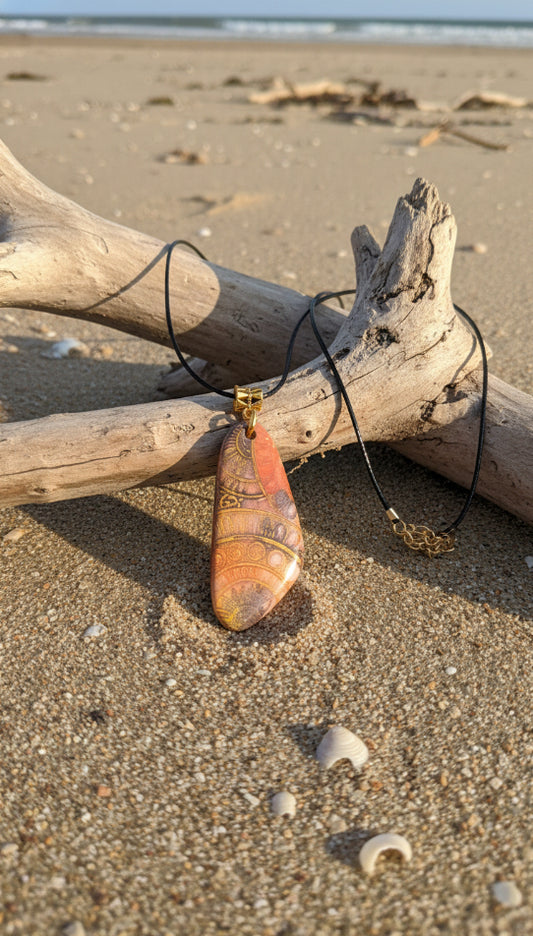 Warm, glowing pendant with golden detail Necklace