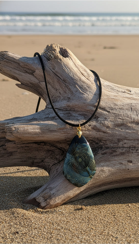 Mysterious pendant swirls with deep ocean blues Necklace