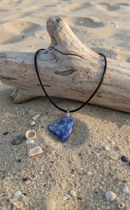 Domed deep and gentle blue swirl through the heart-shaped Necklace