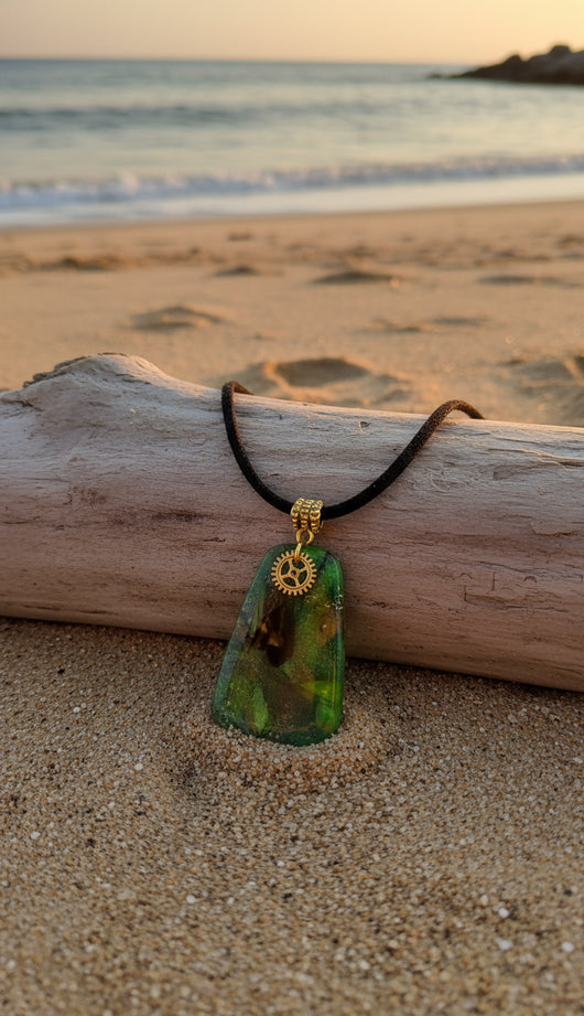 Emerald and mossy green swirl with a small golden gear charm Necklace