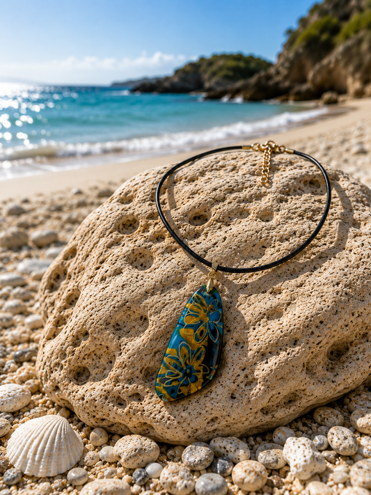 Bold floral-inspired patterns in turquoise blue and warm golden Necklace