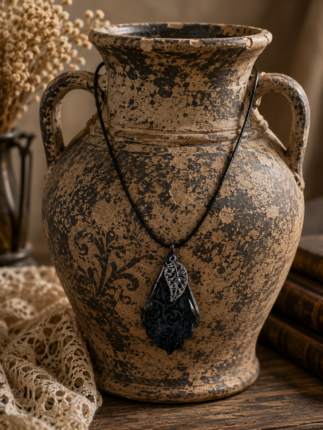 Subtle swirling shimmering patterns and black leaf charm Necklace