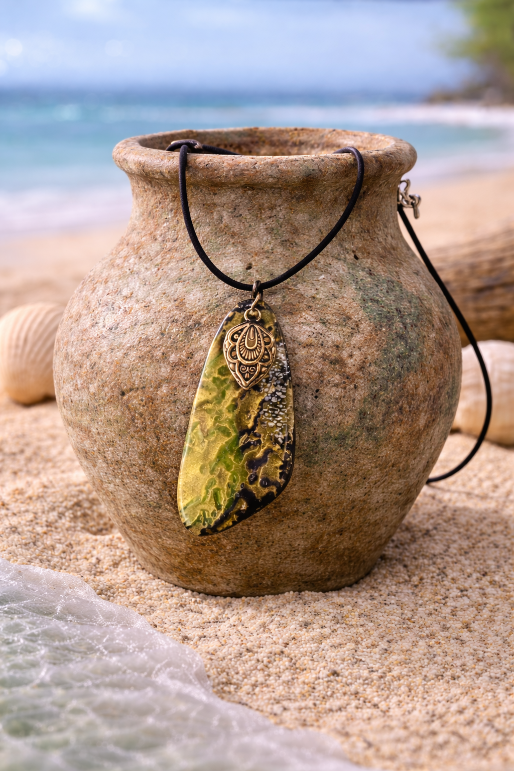 Green, gold, and black pendant with a charm Necklace