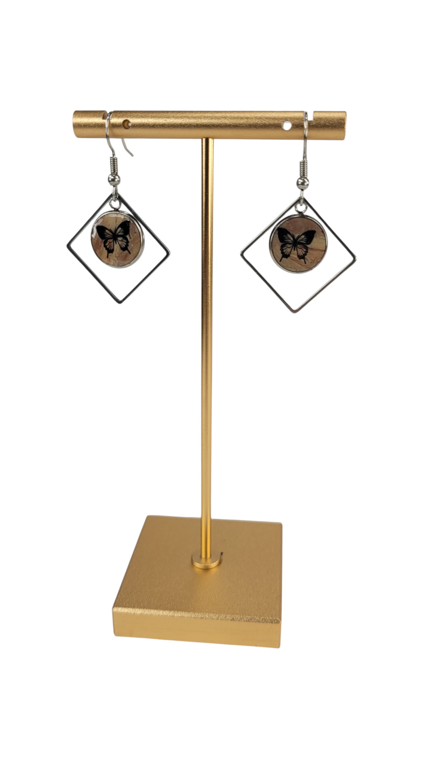 Natural tones with vintage feeling framed by open square shapes Earrings