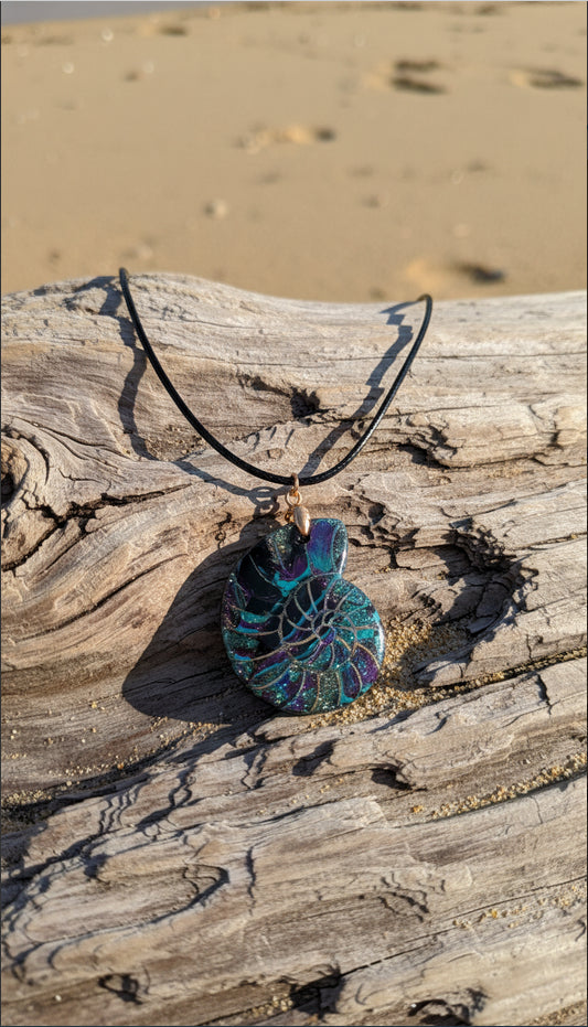 Graceful spiral faux shell with deep ocean hues Necklace
