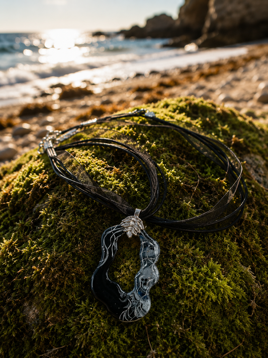 Black and silver freeform pendant on leaf bail Necklace
