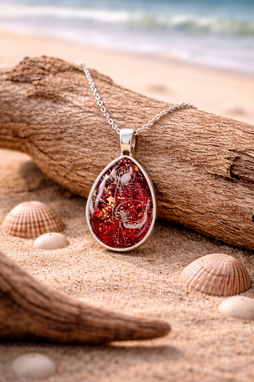 Delicate lily flower on deep red tones teardrop Necklace