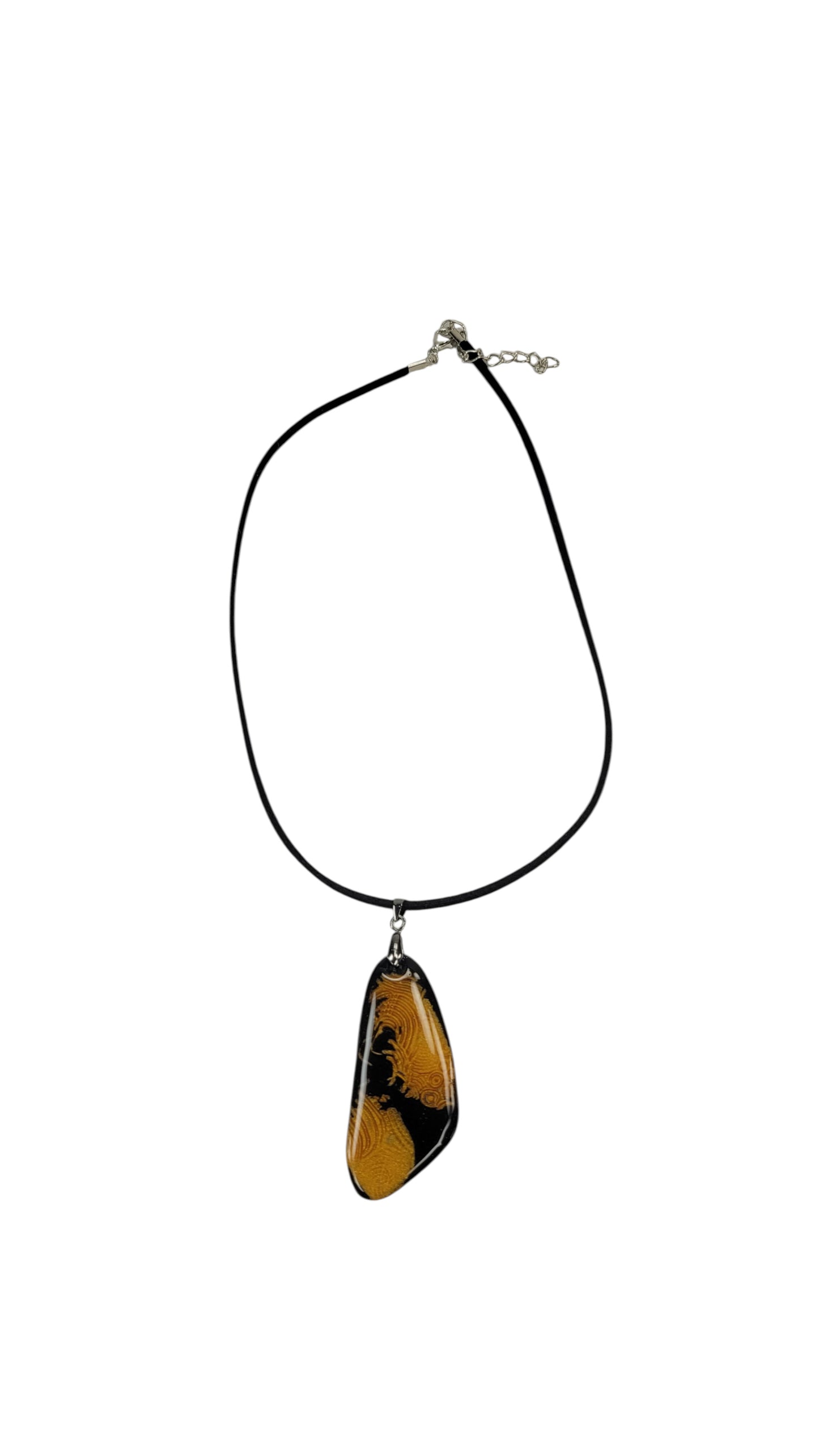 Warm golden tones ripple across black background Necklace